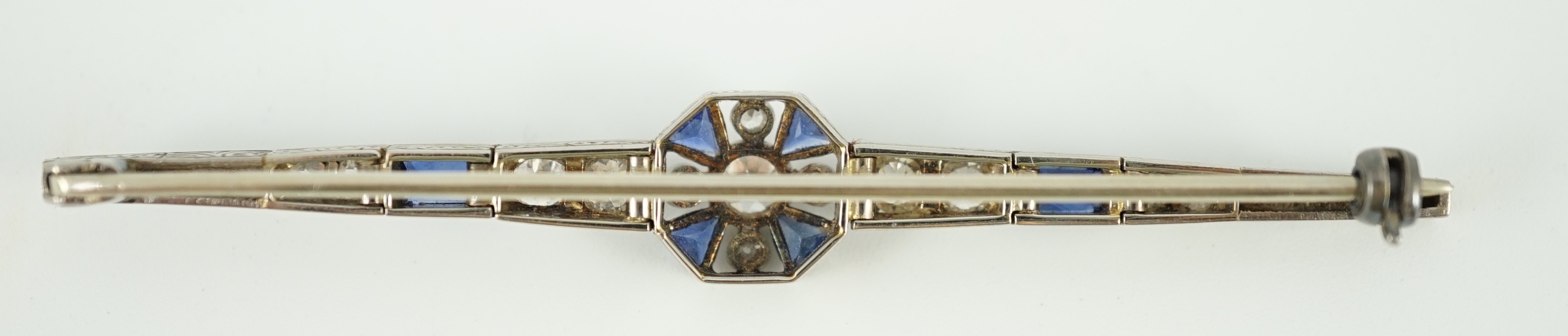 A 1920's/1930's white gold, sapphire and diamond cluster set bar brooch